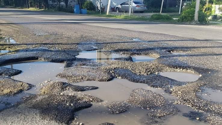 bad road with many potholesin antigua